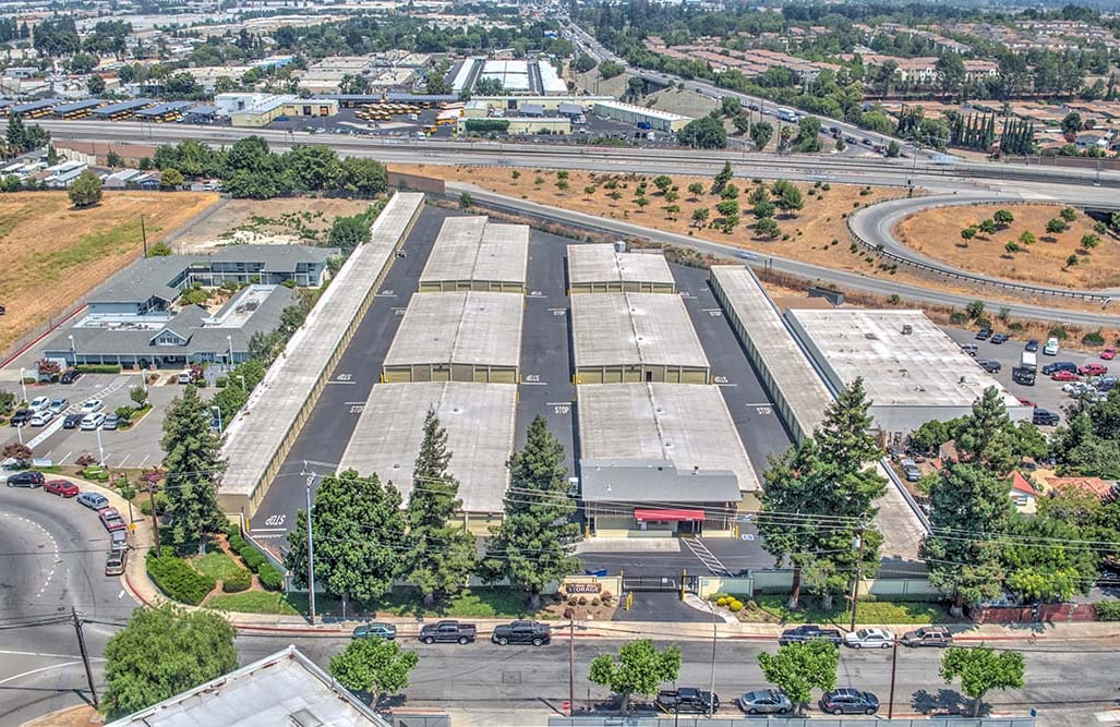 Aerial view of Willow Glen Storage's unit rows, between the street and the freeway
