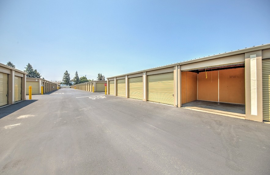 An open drive-up unit at Willow Glen Storage showing the empty interior