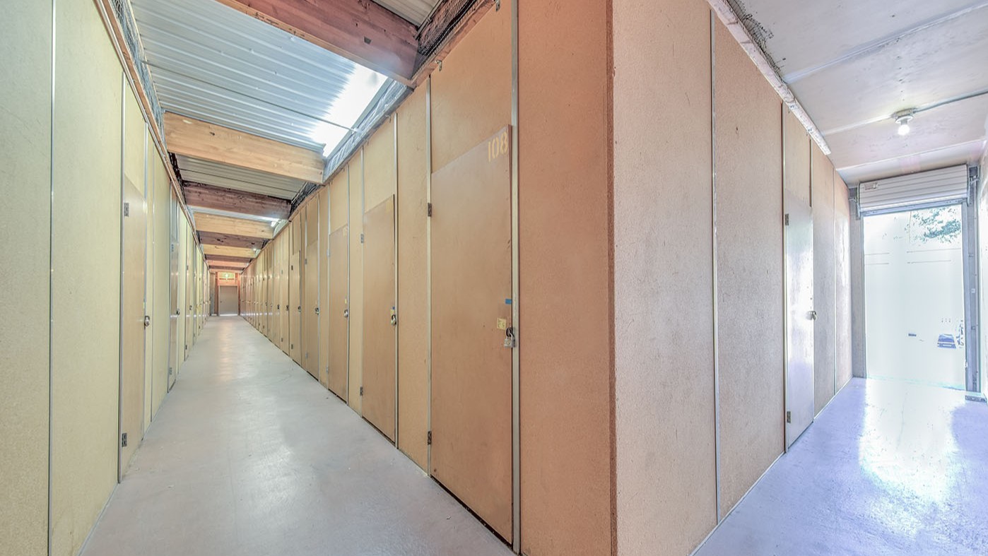 Skylit interior corridor of enclosed storage lockers at Willow Glen Storage